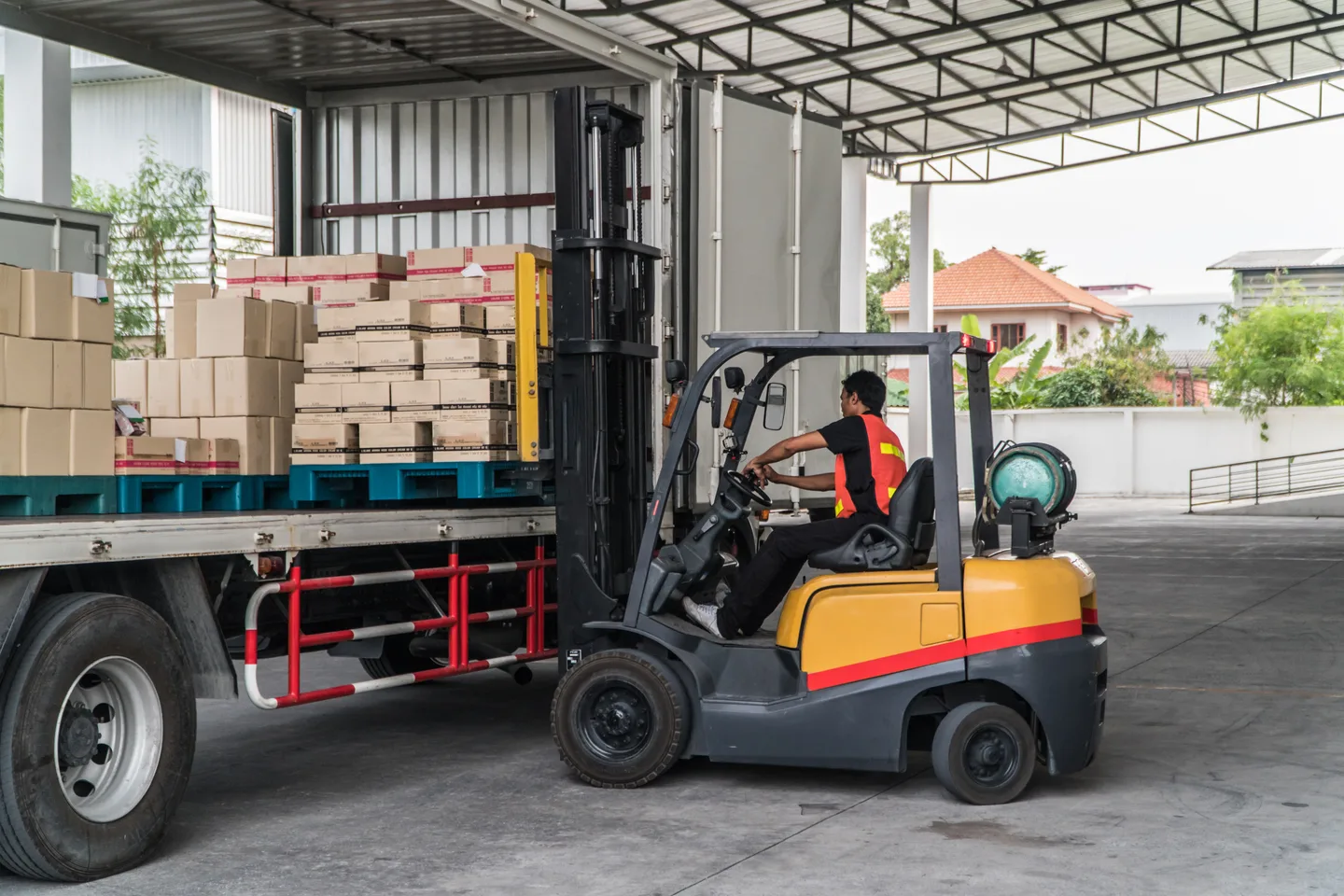 Forklift unloading delivery in a loading zone