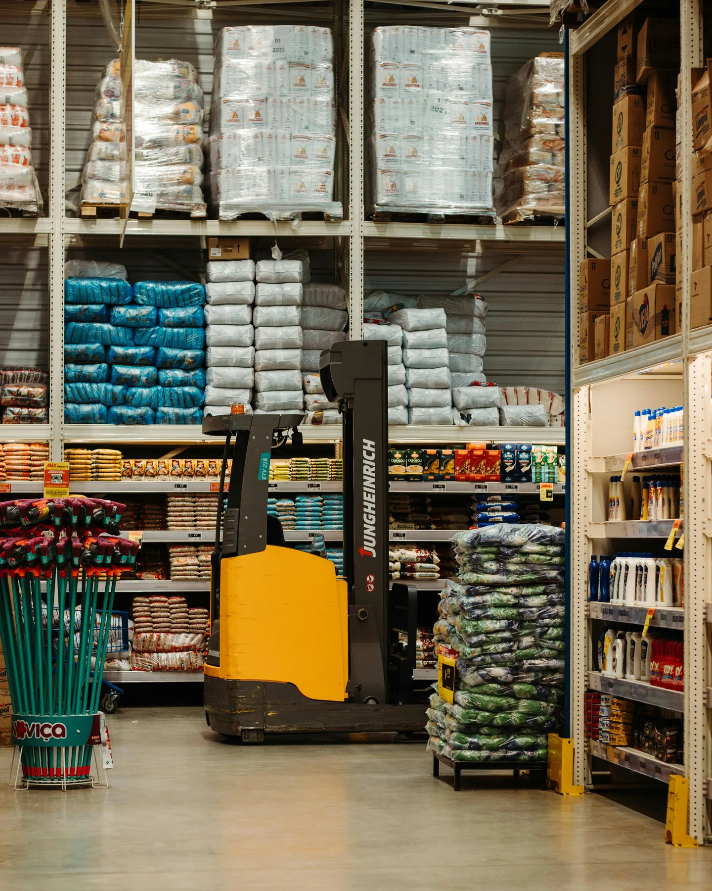 Forklift operating in a warehouse aisle